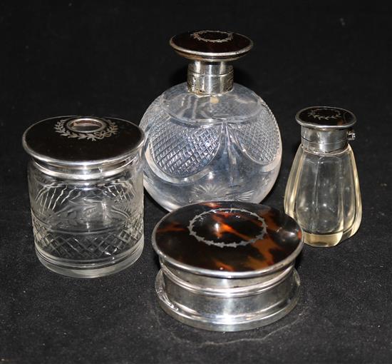 Two silver and tortoiseshell mounted glass scent bottles (one a.f.) a similar box and hair tidy.